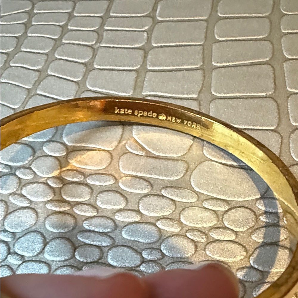 Set of three kate spade Gold, Purple, and Cream Bow Bangle Bracelets - Picture 6 of 6